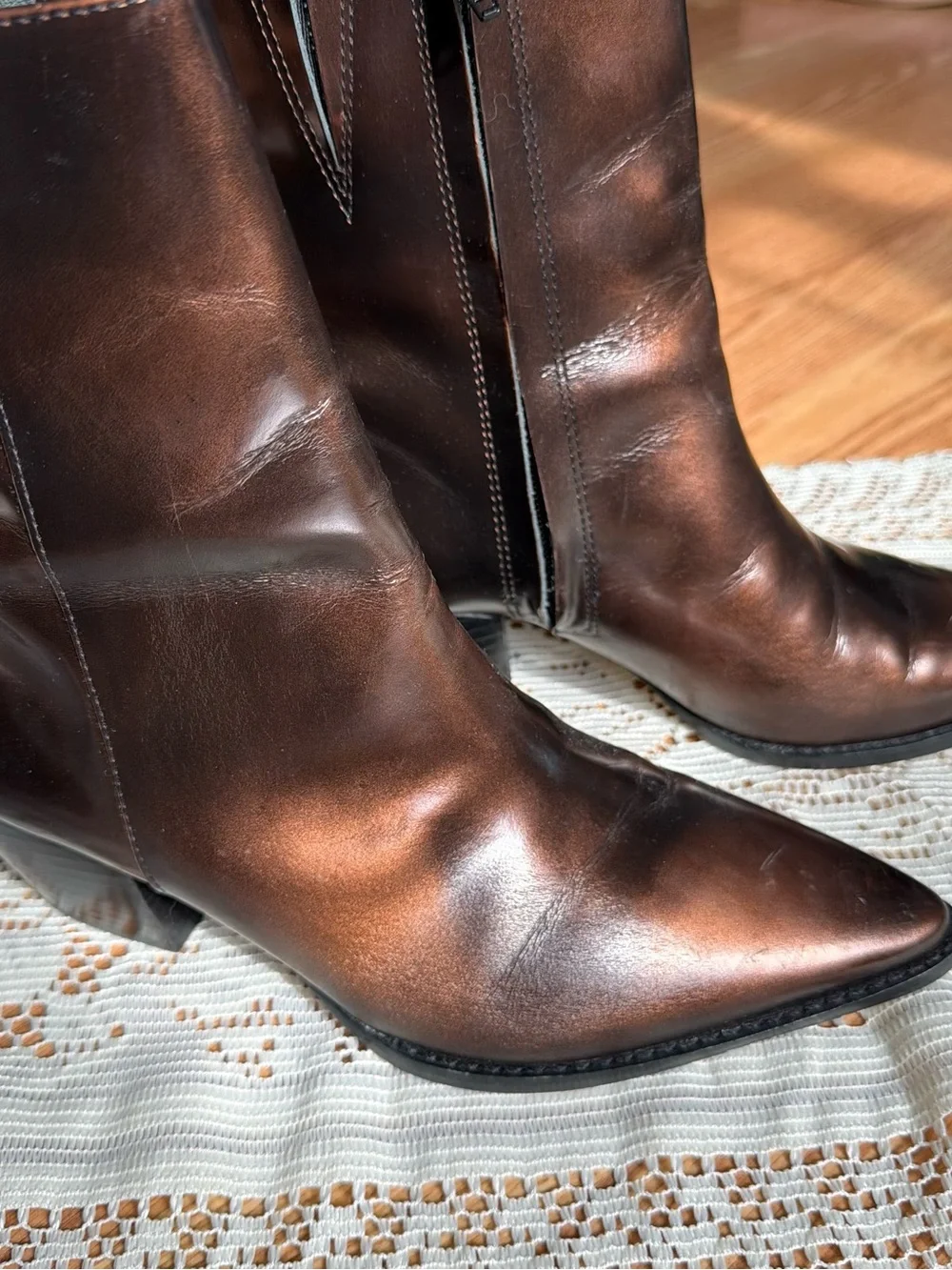 Brown leather boots with a pointed toe